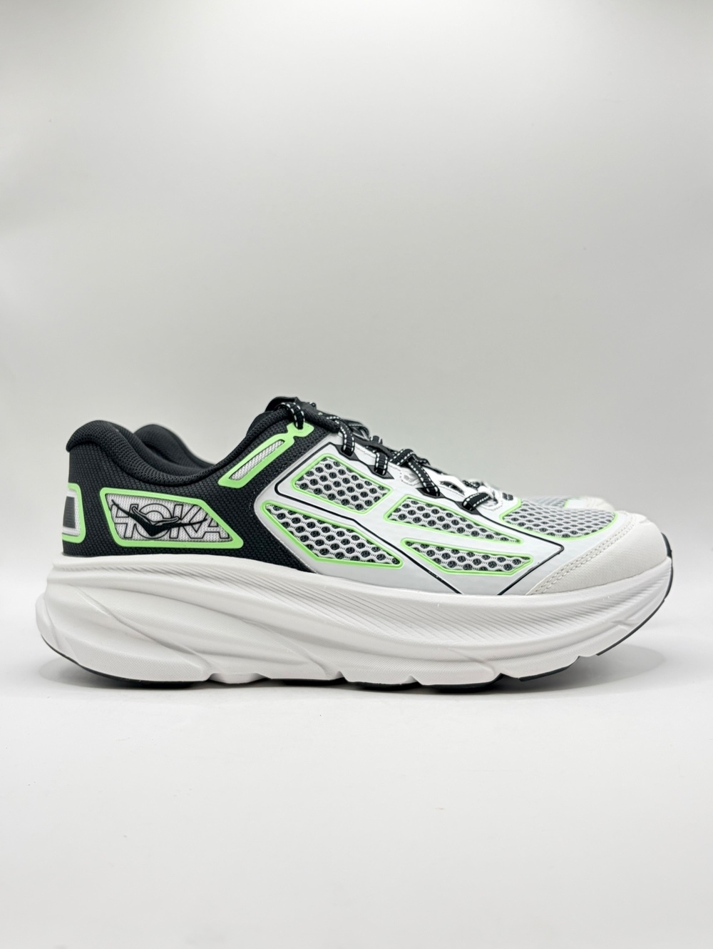 HOKA Clifton One9 sneakers in Black, White and Green 9 Men / 10 Women